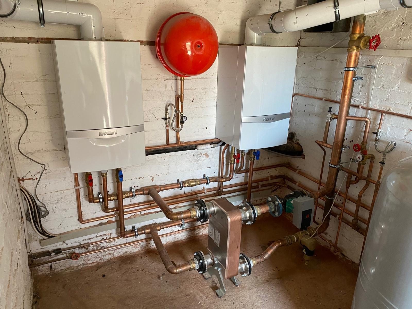 Plant room with plate heat exchanger